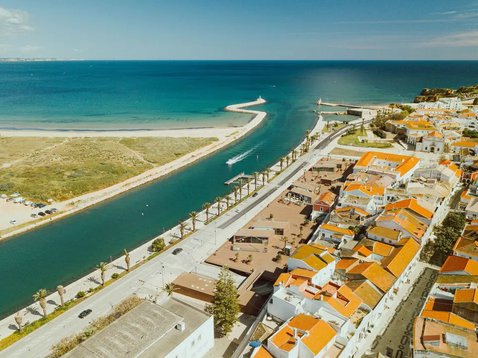 Stunning aerial view of Lagos in the Faro District, showcasing beautiful coastline and architecture.