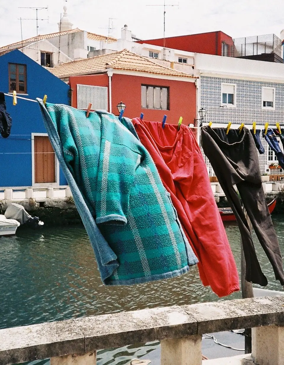 Vibrant houses and drying laundry along a canal in Aveiro, Portugal