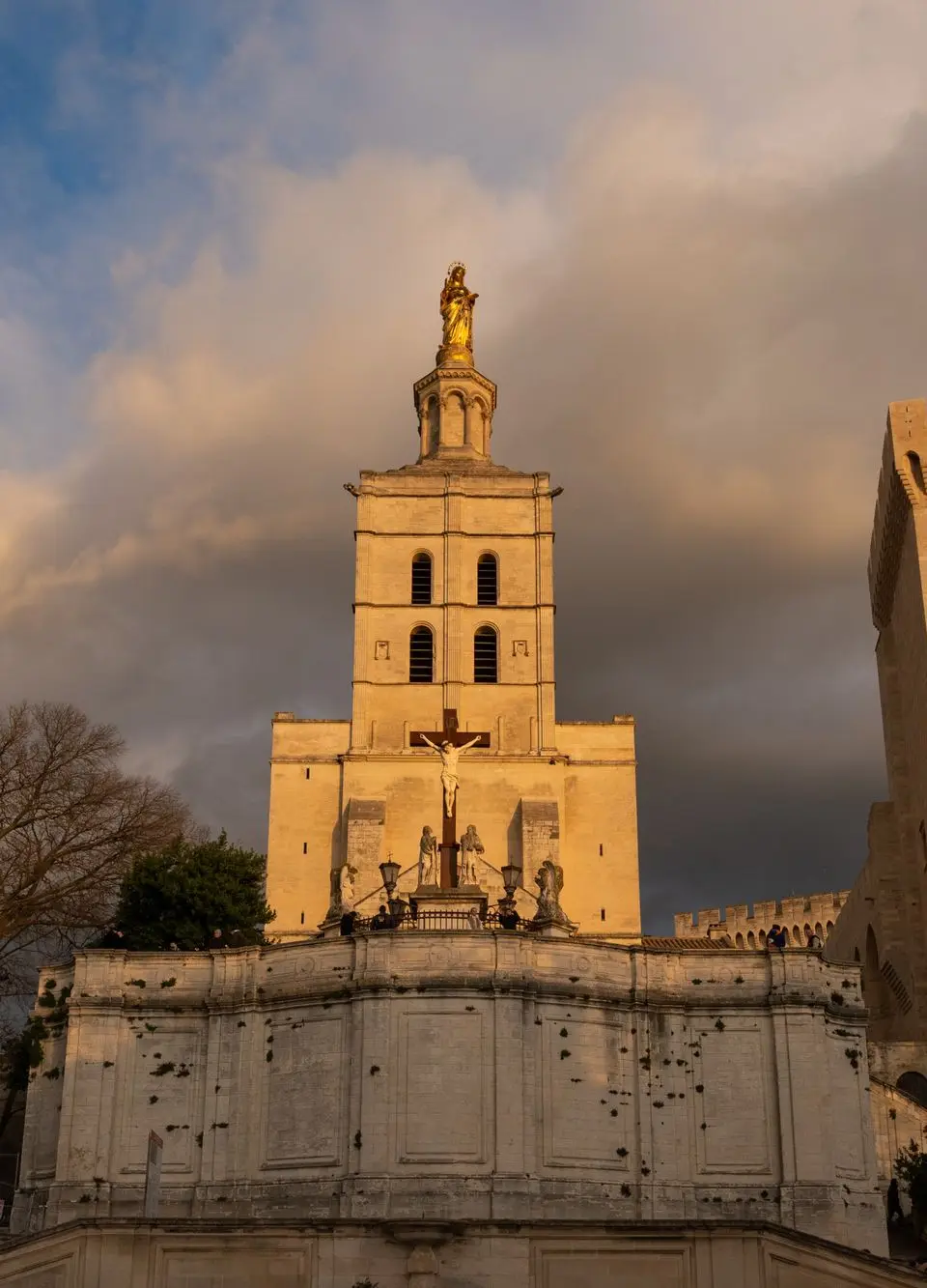 Capture of Avignon Cathedral in the warm glow of sunset, showcasing its historic architecture.