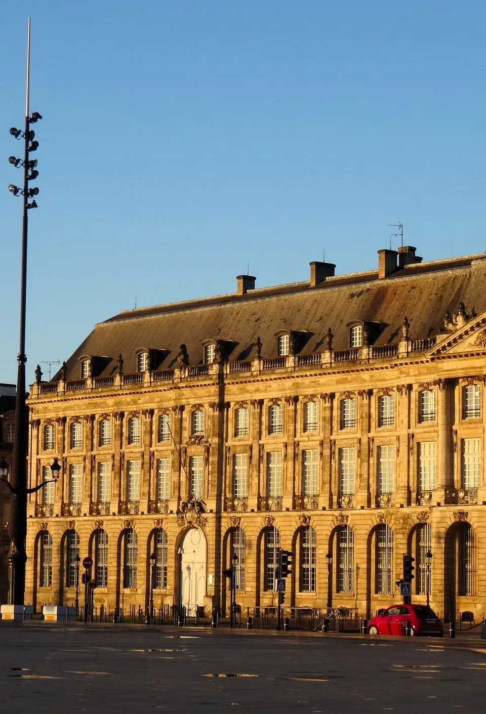 Elegant historic building in Bordeaux, France captured during golden sunset light, highlighting classic French architecture.