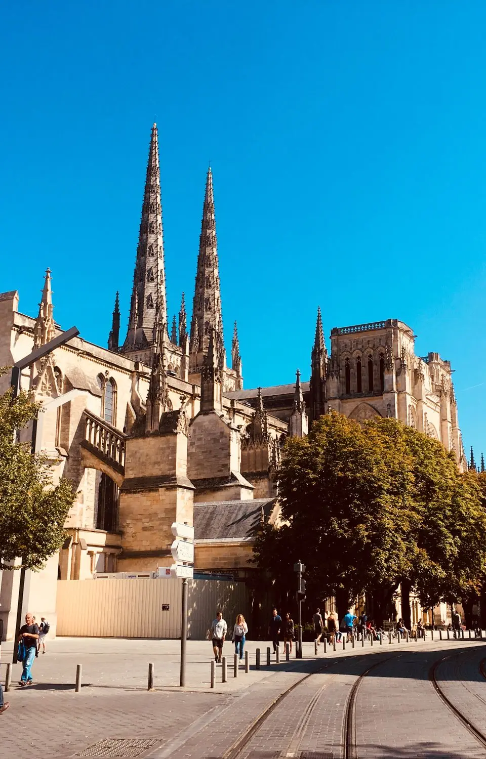 Capture the iconic architecture of Bordeaux's Saint-André Cathedral bathed in sunlight, perfect for travel and architecture enthusiasts.