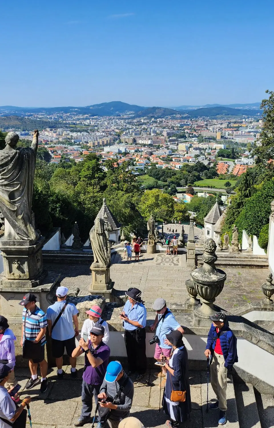 Tourists explore Bom Jesus do Monte with stunning views of Braga, Portugal.