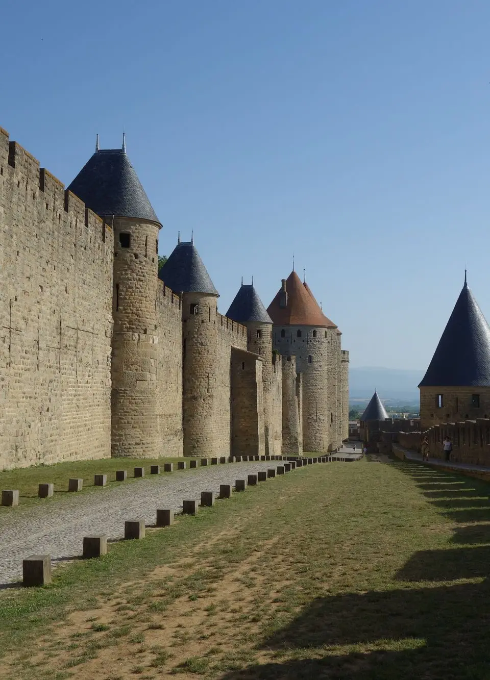 Explore the ancient fortified walls of Carcassonne in France, showcasing medieval architecture and historic charm.