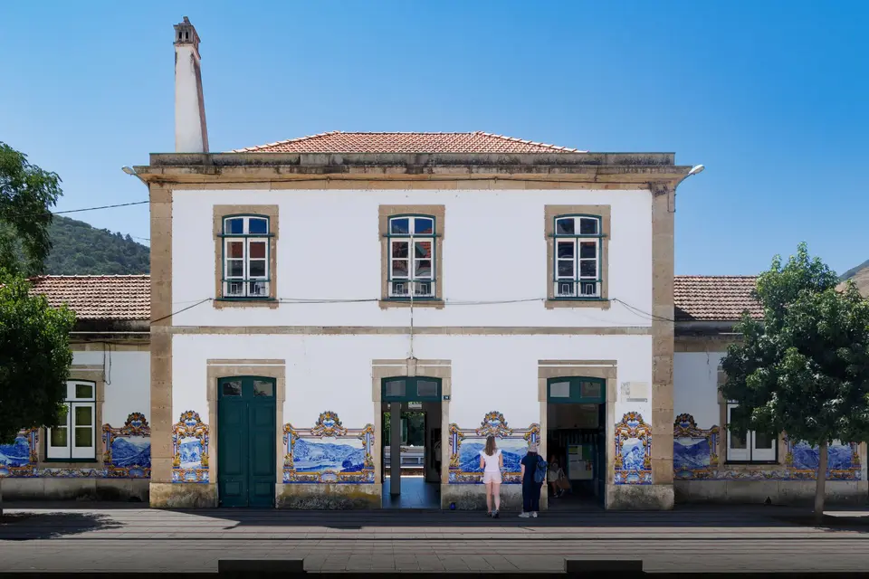 Explore the charm of Pinhão's historic train station with vibrant tiles and classic architecture.