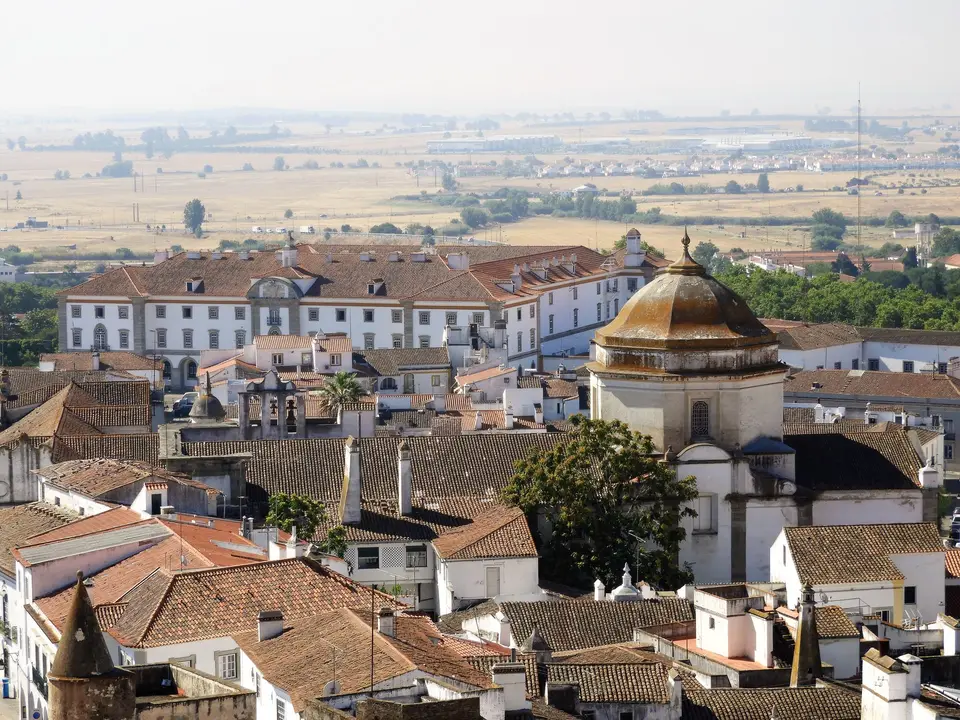 Aerial shot of the picturesque historic town of Evora, Portugal, featuring traditional architecture.