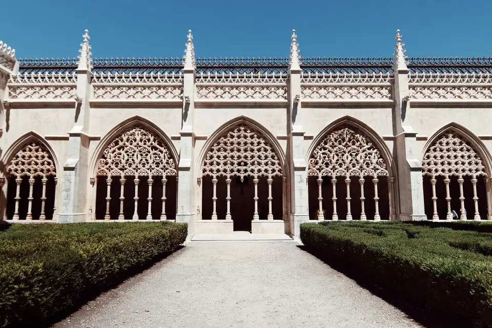 Explore the intricate Gothic arches of the Batalha Monastery in Portugal, a UNESCO World Heritage Site.