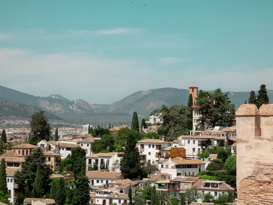 Explore the picturesque view of traditional Andalusian architecture in Granada, Spain.
