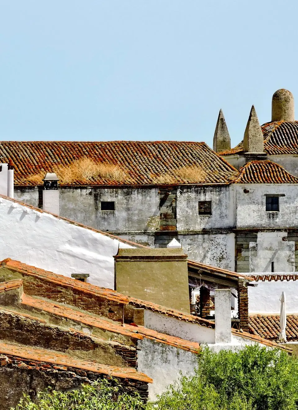 View of the historic Monsaraz Castle with scenic surroundings in Portugal's Alentejo region.