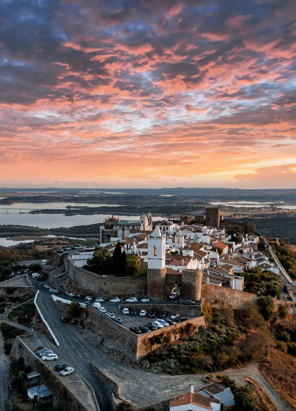 Explore the stunning sunset over Monsaraz village in Évora, Portugal.