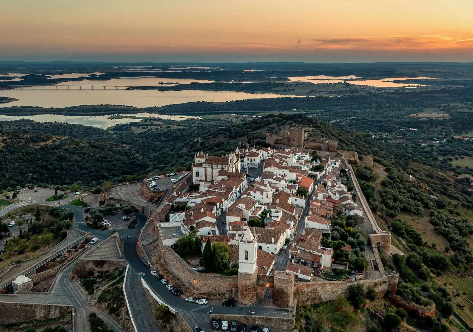 Stunning aerial shot of Monsaraz village in Alentejo, Portugal during sunset. Scenic landscape and historic architecture.