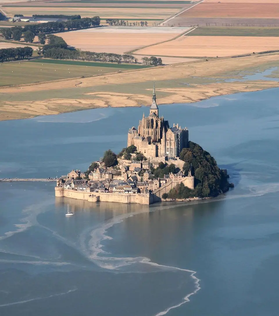 Stunning aerial view of Mont Saint-Michel in Normandie, a famous UNESCO World Heritage site.