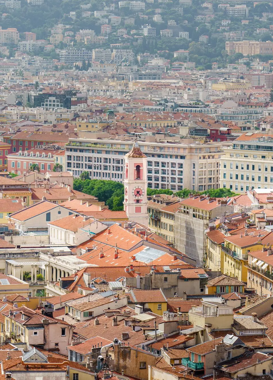 Explore the charming urban landscape of Nice, France, with its iconic red rooftops and historic architecture.