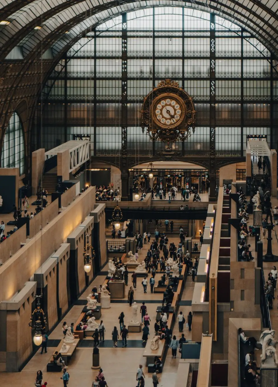 A bustling interior of the iconic Musée d'Orsay in Paris, France.