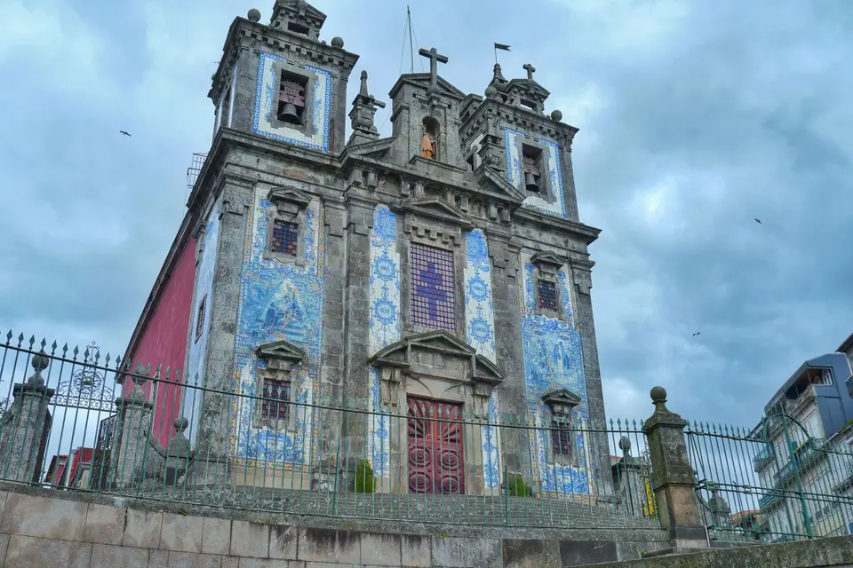 Stunning historic church in Porto with iconic blue tiles and classic architecture.