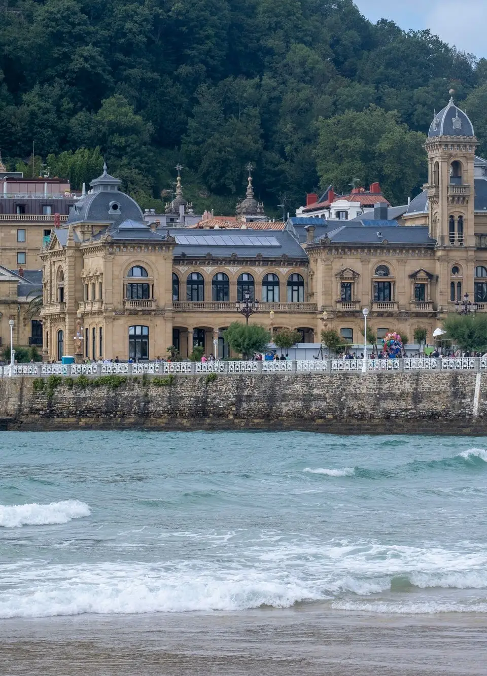 Historic building along the coast of San Sebastián, showcasing grand architecture and vibrant sea views.