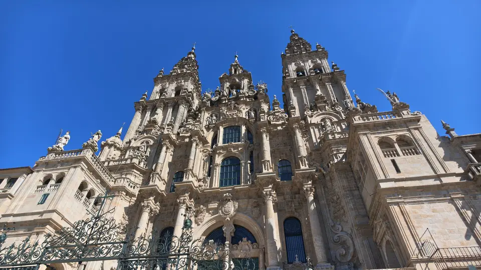 Stunning architectural shot of Santiago de Compostela Cathedral under a clear blue sky.