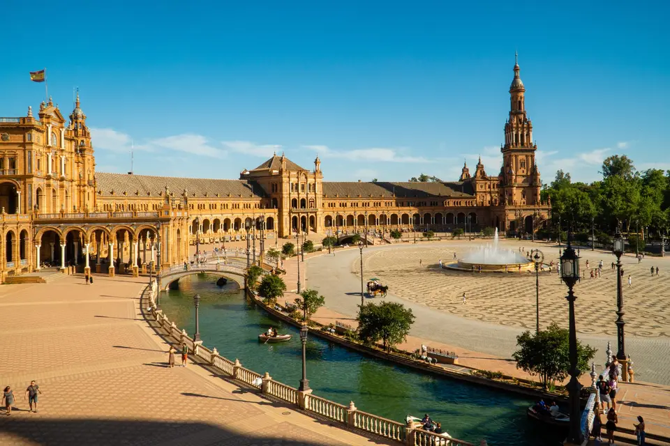 Captivating aerial view of the historic Plaza de España in sunny Seville, Spain.