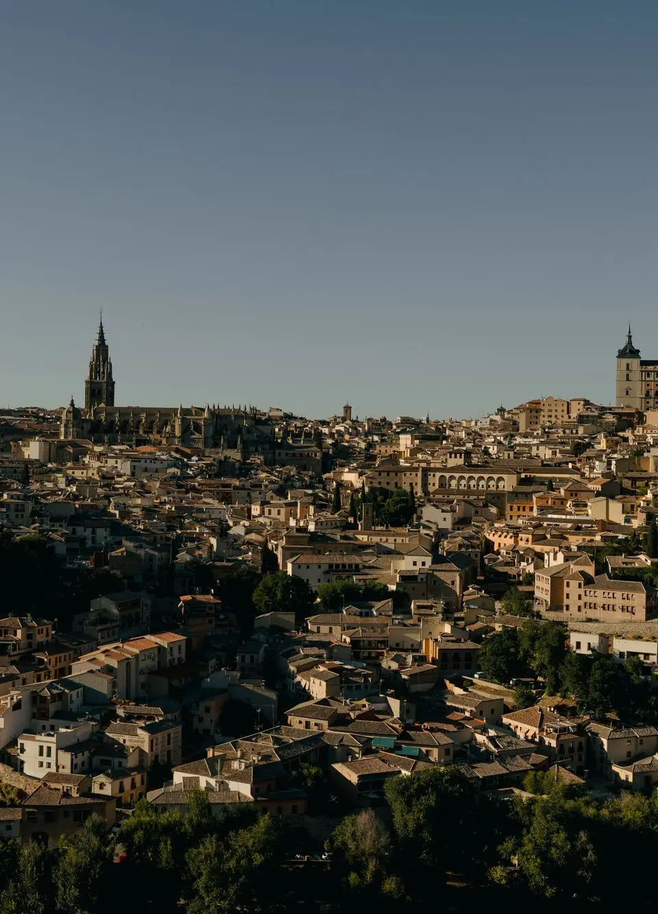 Captivating aerial view of Toledo's historic architecture under a clear sky in Castilla-La Mancha, Spain.