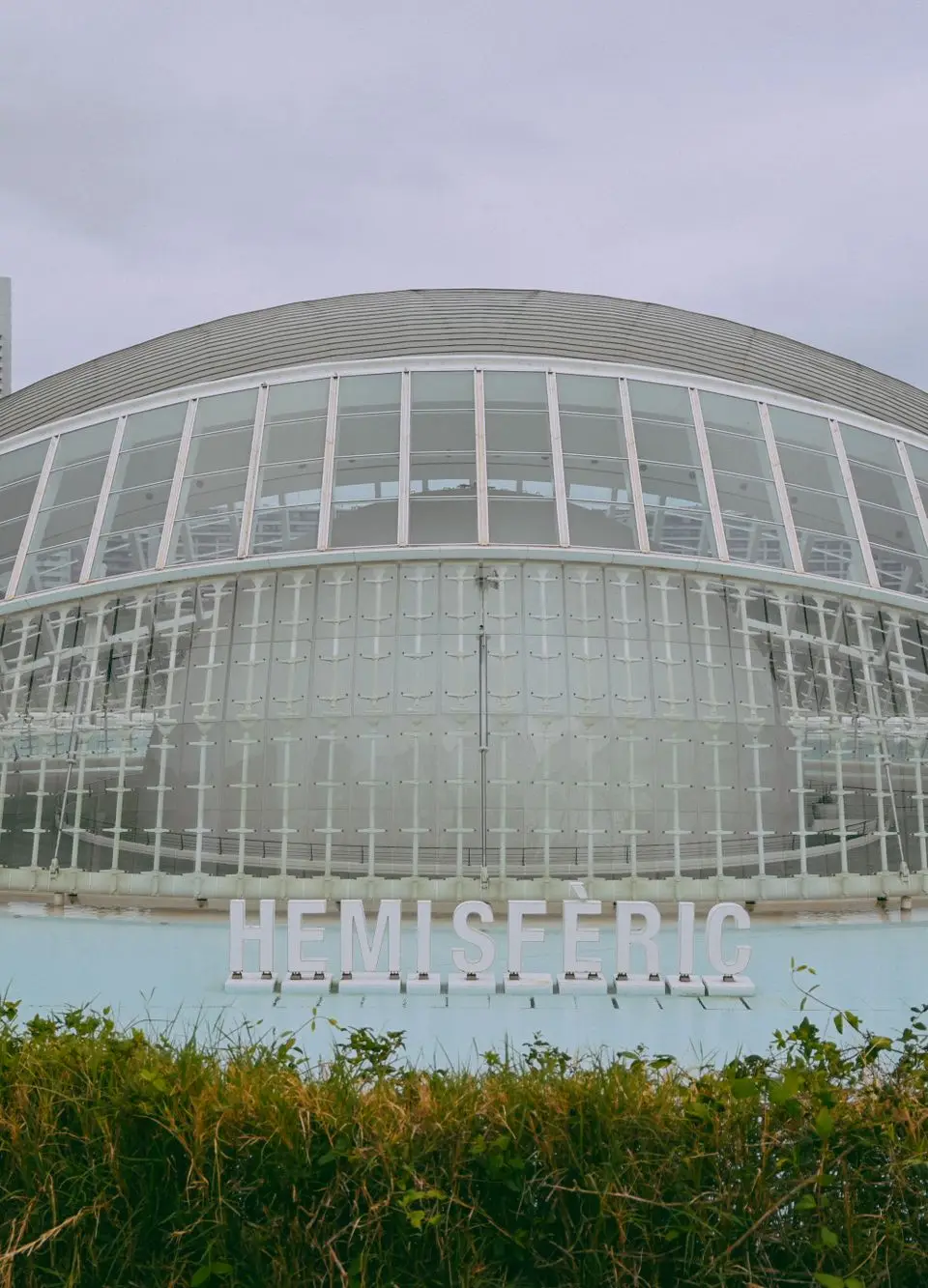 Iconic Hemisferic at City of Arts and Sciences in Valencia, showcasing modern architectural design.