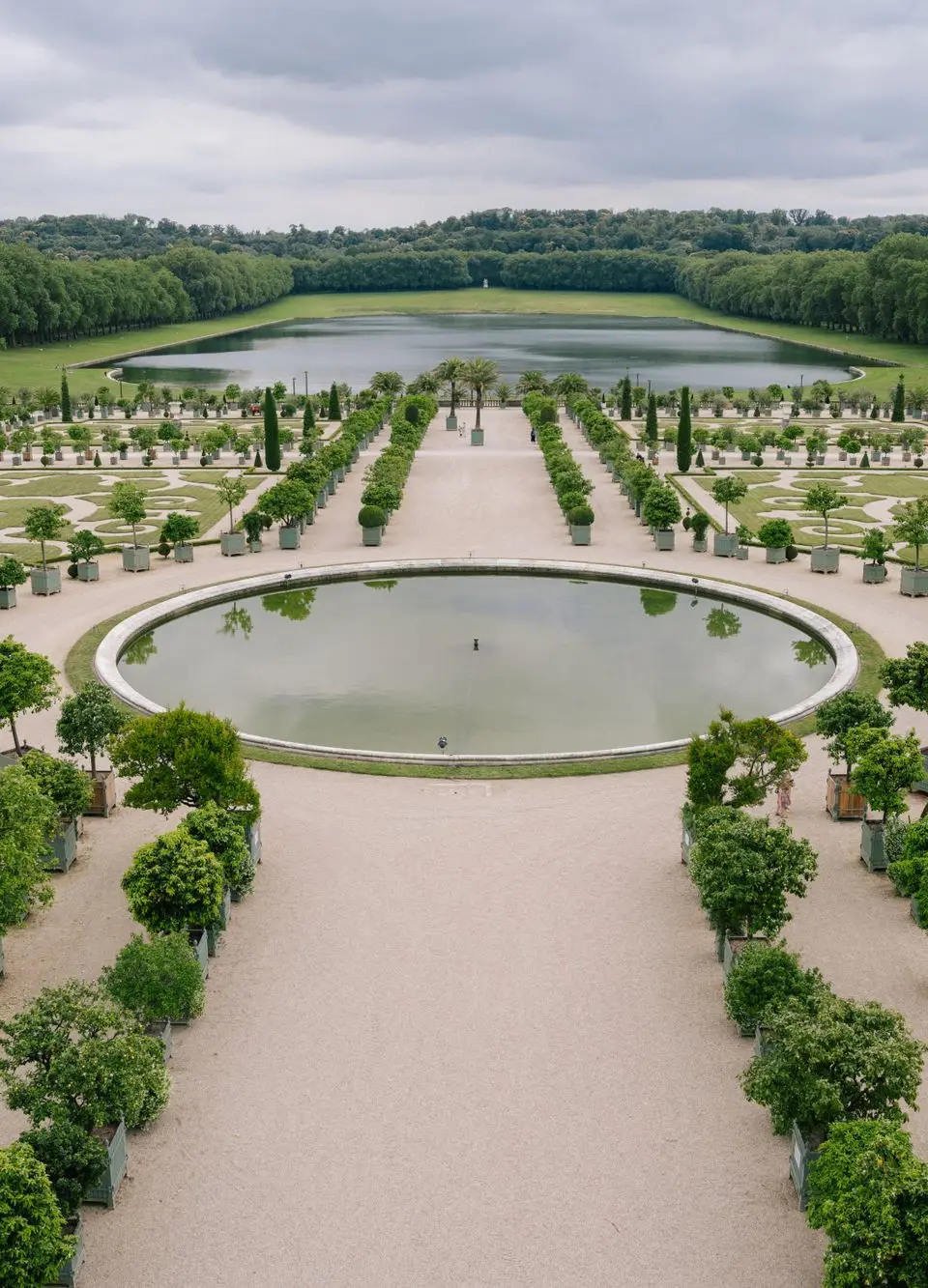 Explore the intricate gardens of Versailles, showcasing nature's beauty and elaborate design in a vast outdoor setting.